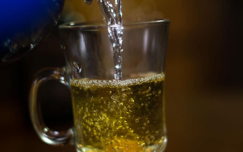 Water being poured into toddy glass
