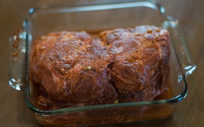 Pork shoulder being brined