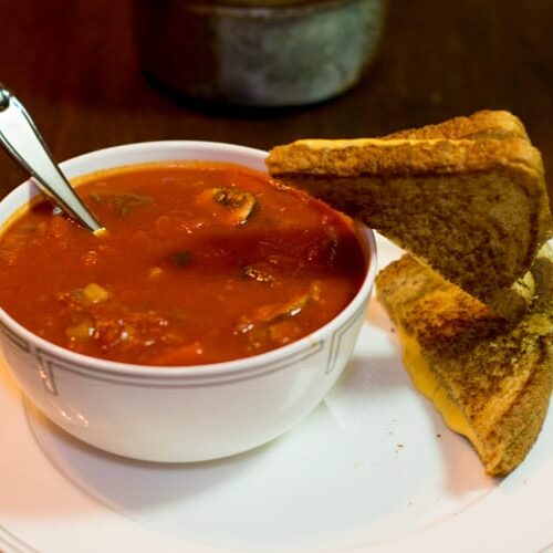 Grilled cheese going headlong into tomato soup