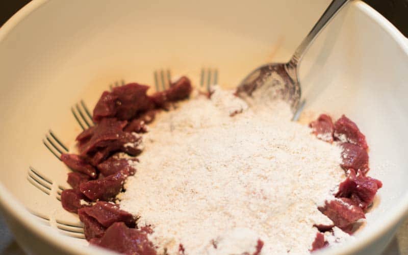 Adding flour to the buffalo