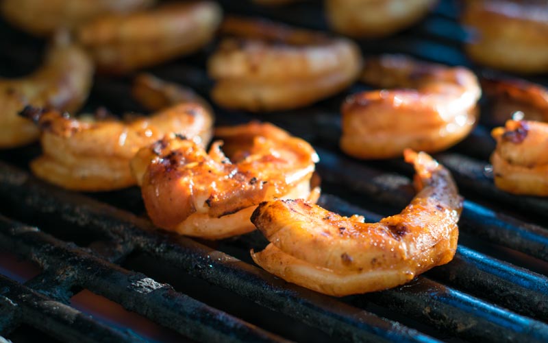Adding the olive oil and lemon juice help keep the shrimp from sticking to the grill