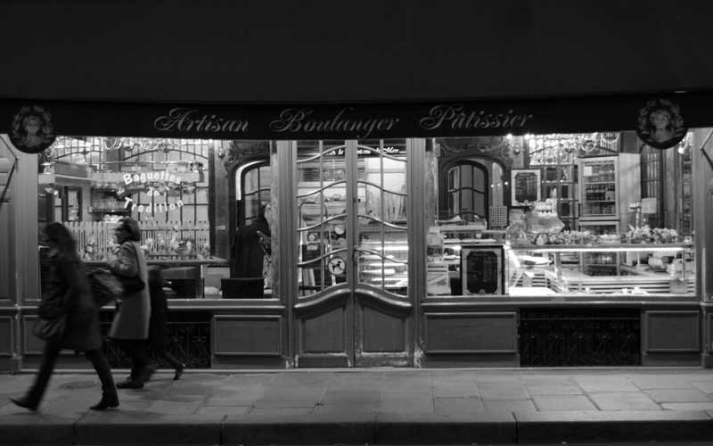 A pastry shop at dusk