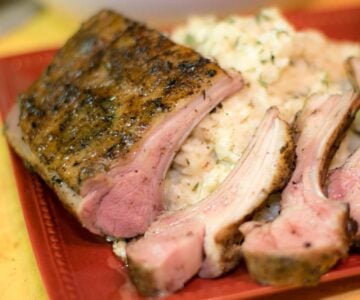 Sous vide rack of lamb sliced and served with risotto